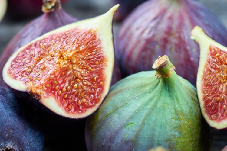 Fresh fig fruits on a wooden table
