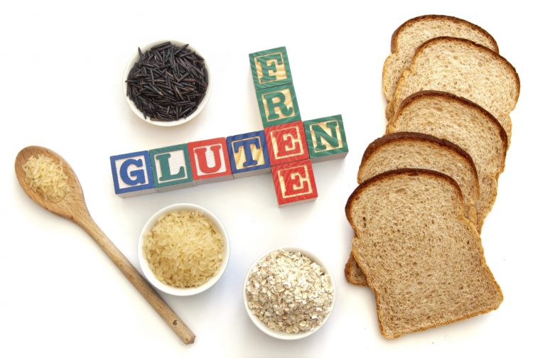 Letter blocks surrounded with gluten free products including wild rice and oats